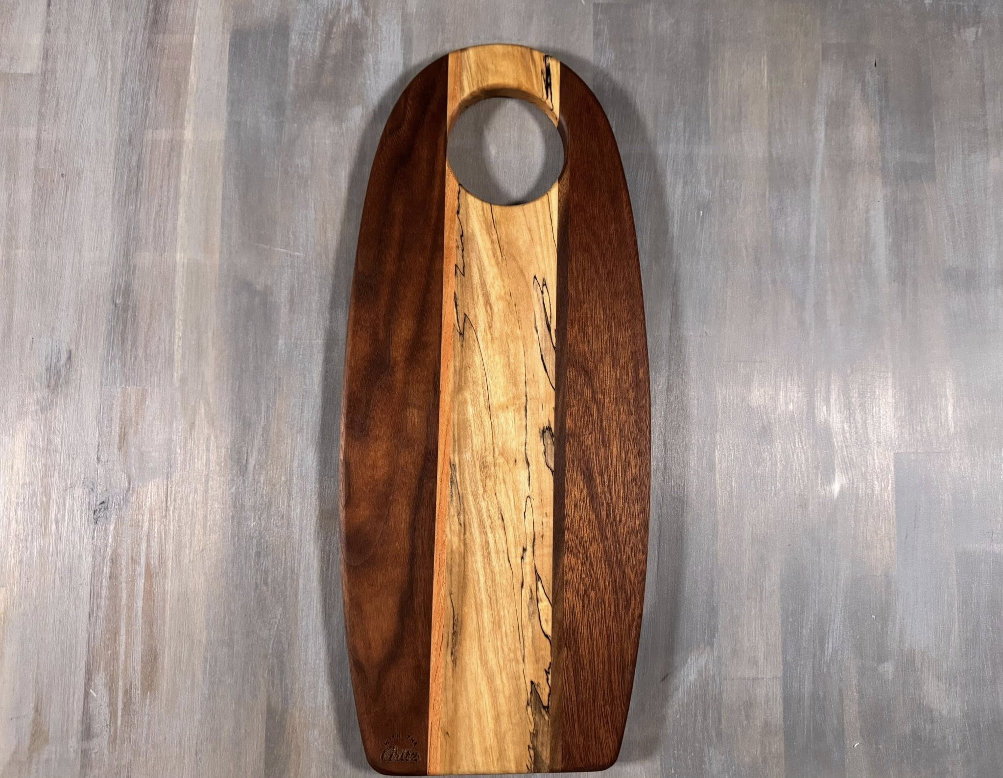 With the Gritz Custom Flat Oval Cutting Board