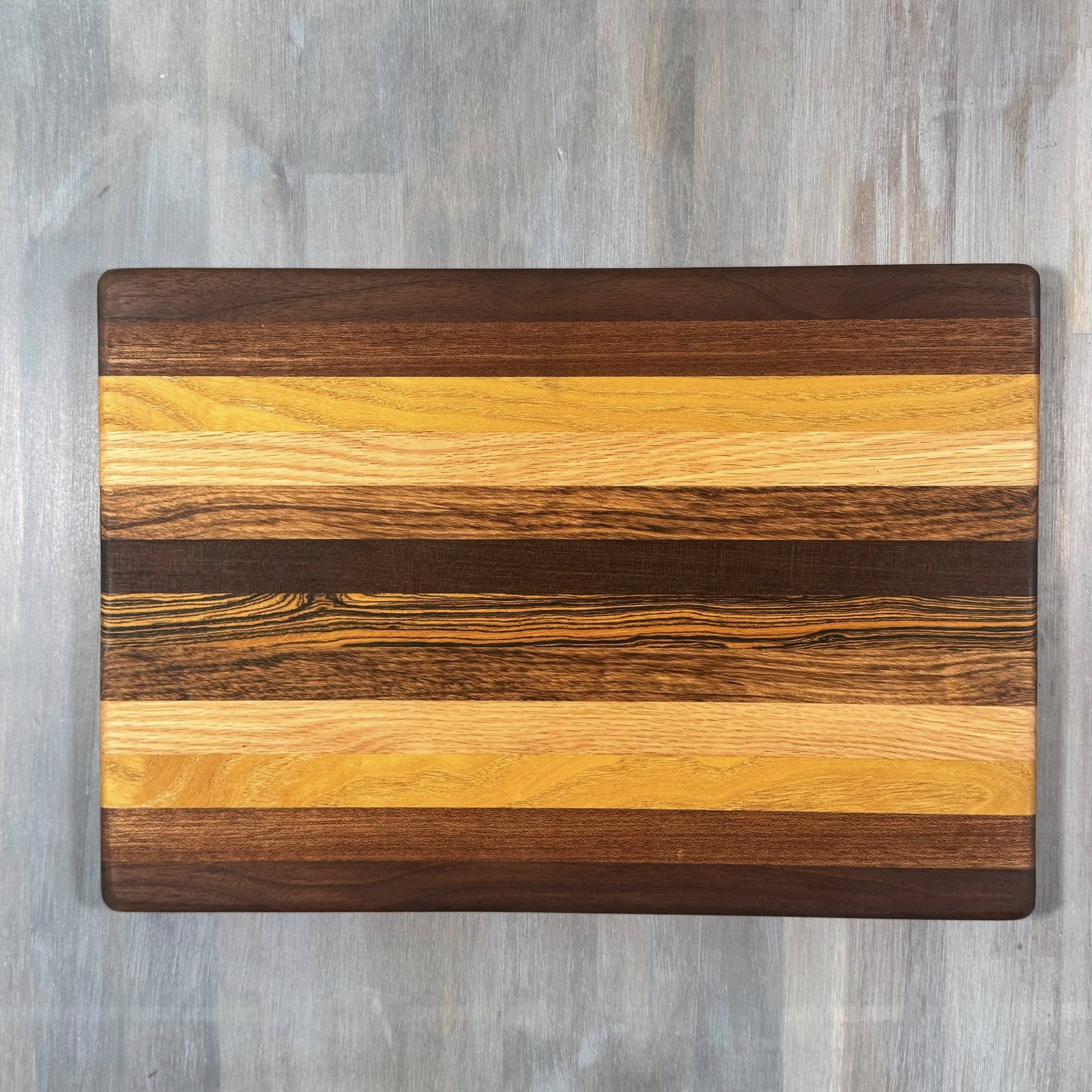 With the Gritz Classic Rectangle Cutting Board | 15x10 | Assorted Wood